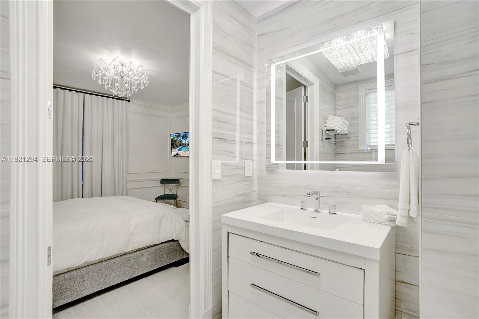 10400 Southwest 62nd Street Miami, FL 33173 - Photo 14 of 34 a bathroom with a sink and a mirror