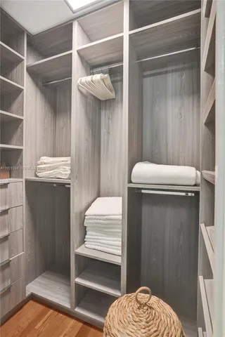 a room with a door and a wooden floor