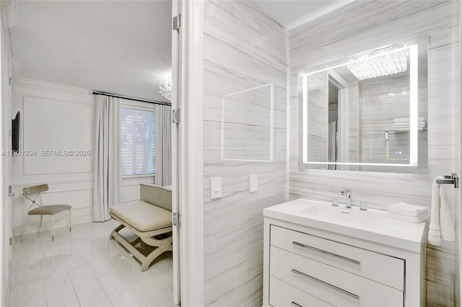 10400 Southwest 62nd Street Miami, FL 33173 - Photo 17 of 34 a bathroom with a sink toilet a mirror and shower