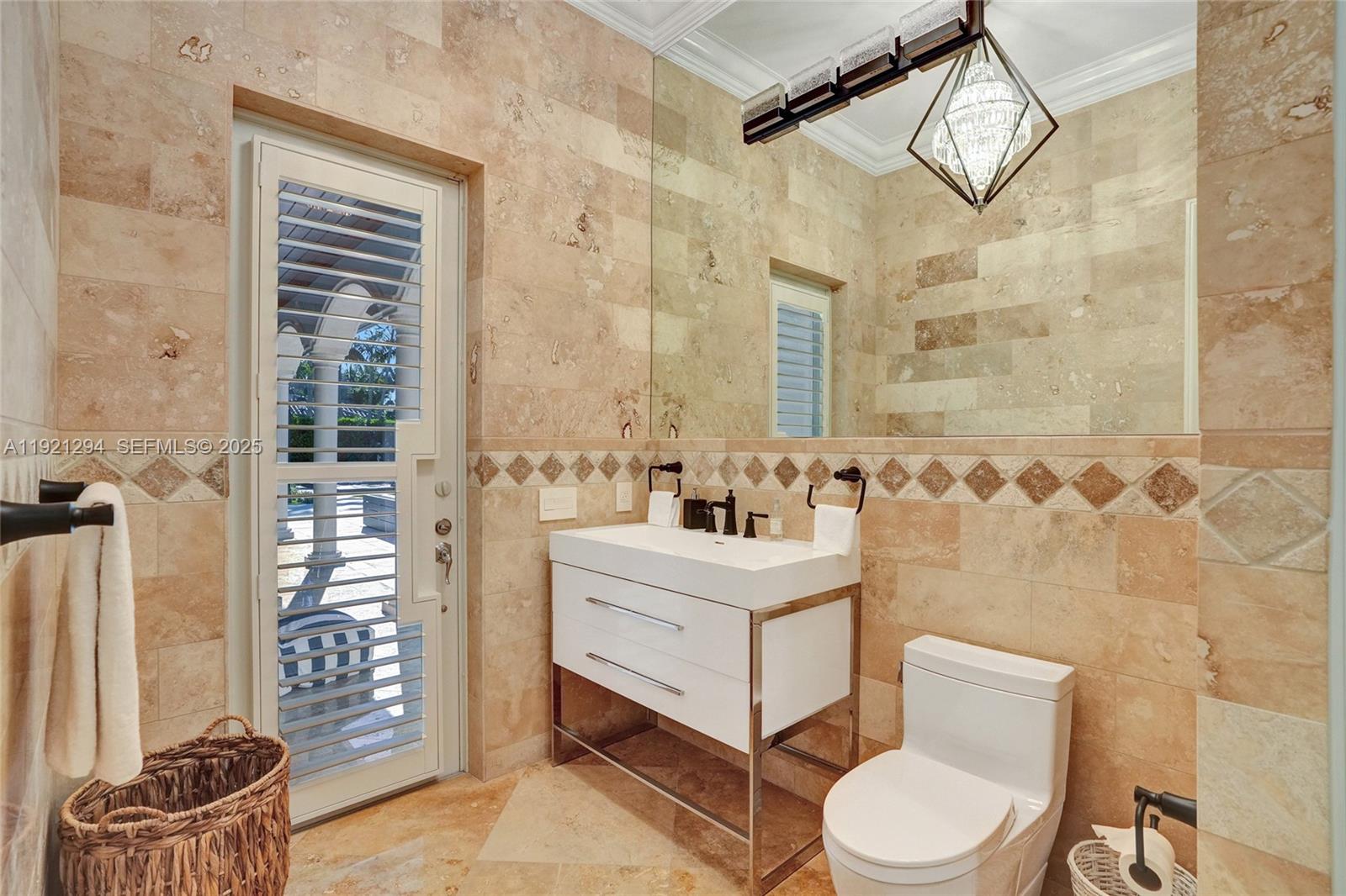 10400 Southwest 62nd Street Miami, FL 33173 - Photo 23 of 34 a bathroom with a sink a toilet and shower