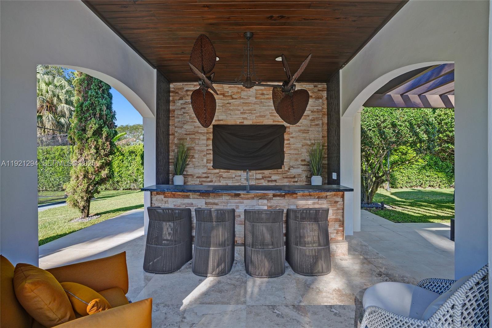 10400 Southwest 62nd Street Miami, FL 33173 - Photo 31 of 34 a living room with fireplace furniture and a flat screen tv