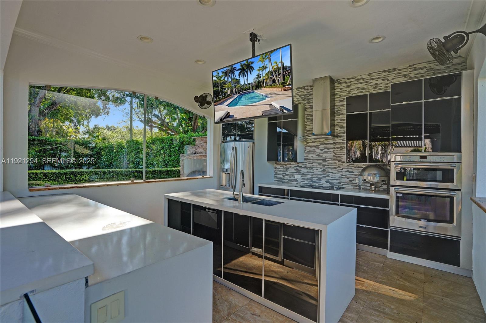10400 Southwest 62nd Street Miami, FL 33173 - Photo 32 of 34 a kitchen with a stove and a sink