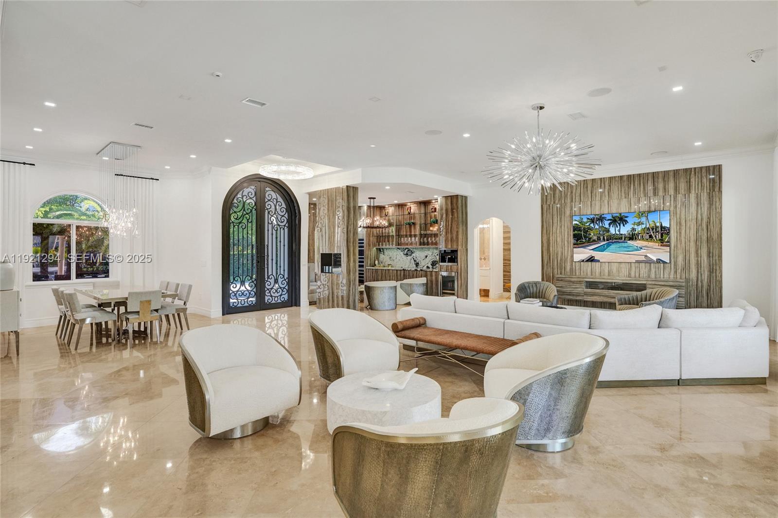 10400 Southwest 62nd Street Miami, FL 33173 - Photo 10 of 34 a living room with fireplace furniture and a chandelier