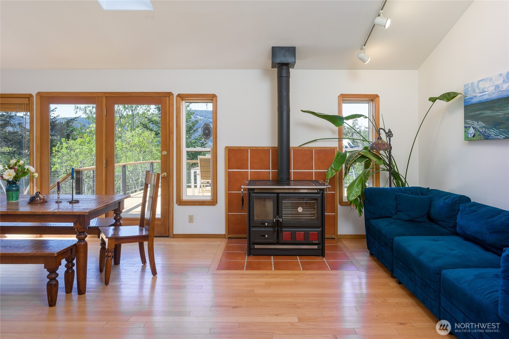 486 Wildwood Road Orcas Island, WA 98245 - Photo 11 of 37 a living room with furniture and a wooden floor