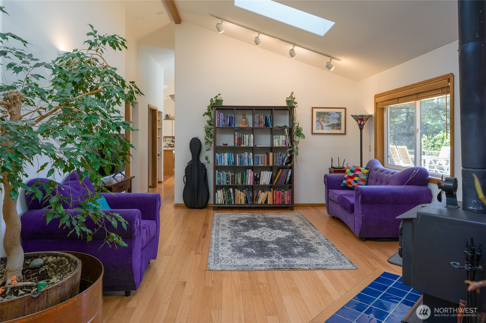 486 Wildwood Road Orcas Island, WA 98245 - Photo 13 of 37 a living room with furniture and a potted plant