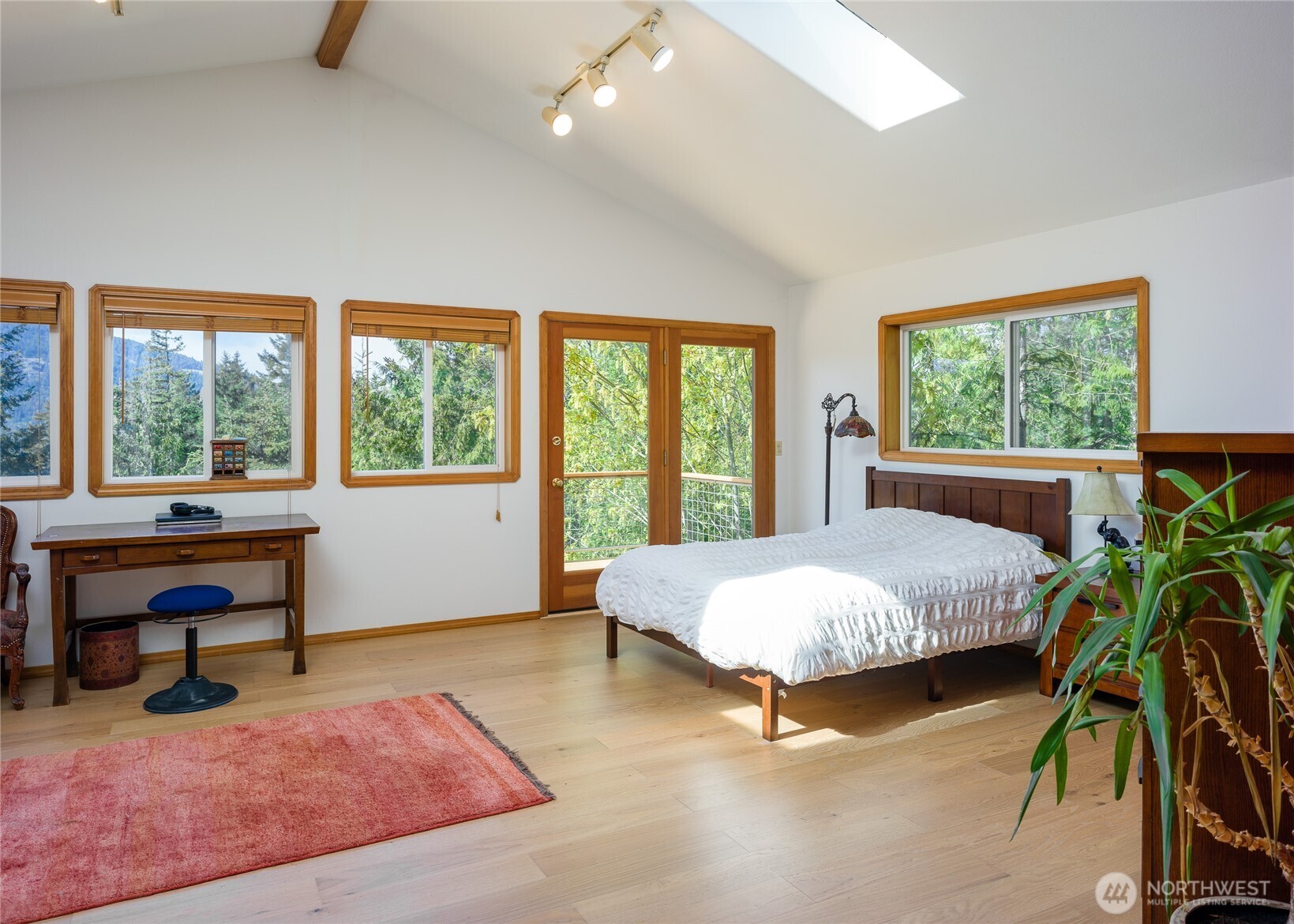 486 Wildwood Road Orcas Island, WA 98245 - Photo 14 of 37 a living room with furniture and a potted plant