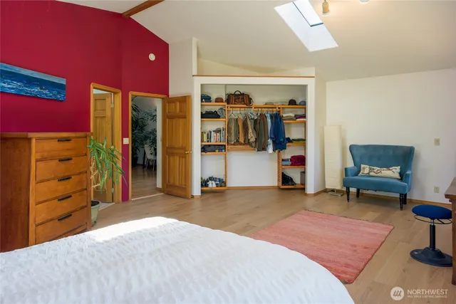 a bedroom with a bed and a view of bedroom