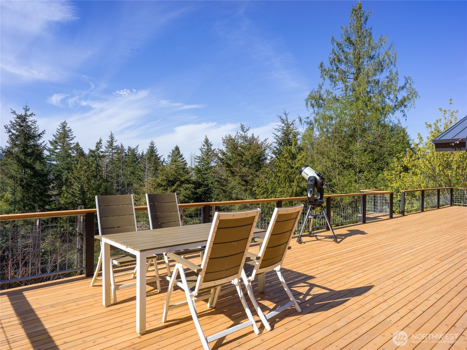 486 Wildwood Road Orcas Island, WA 98245 - Photo 21 of 37 a view of a chairs and table on the wooden floor