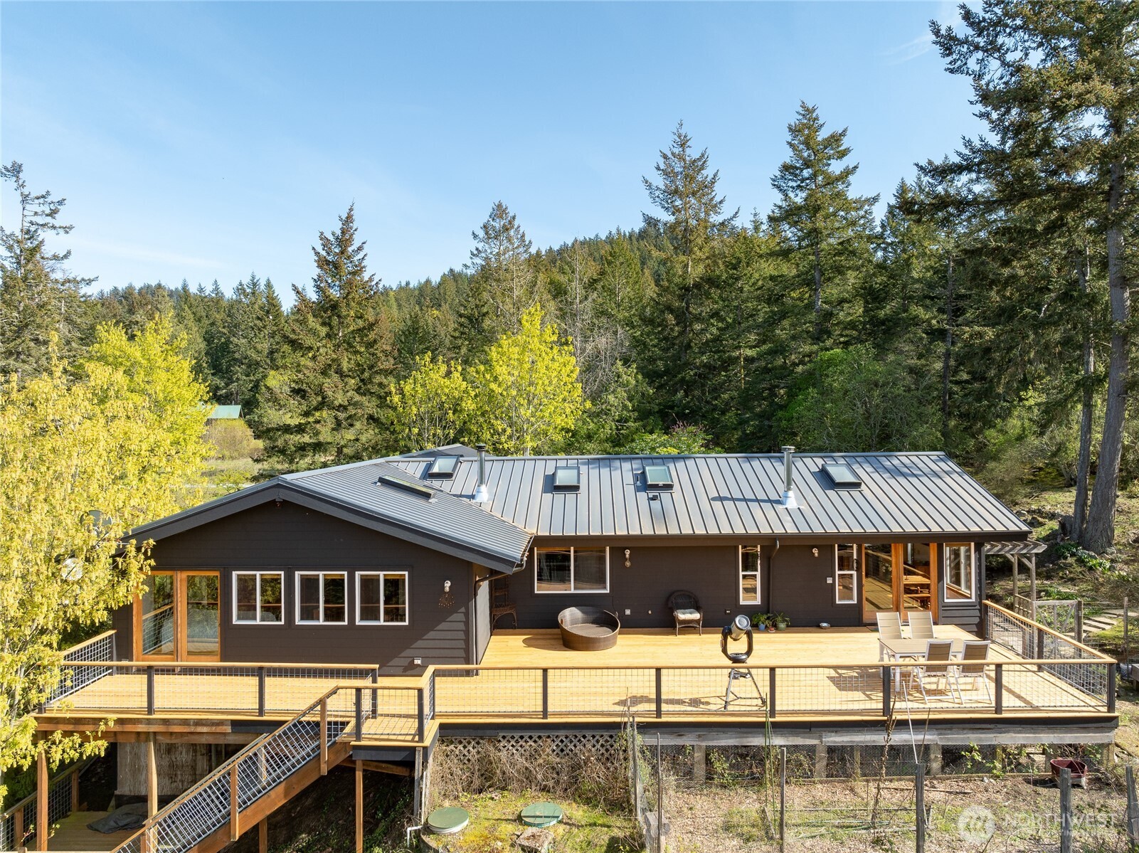 486 Wildwood Road Orcas Island, WA 98245 - Photo 23 of 37 a roof view covered with large trees