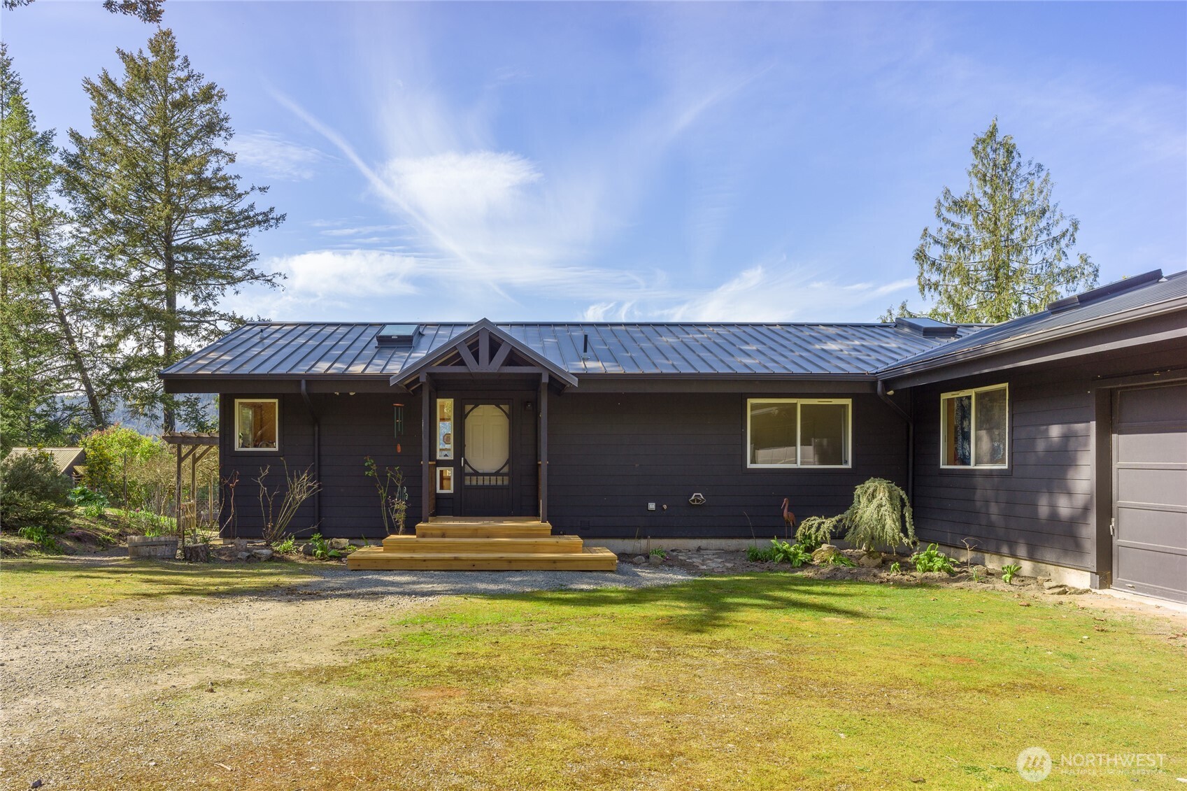 486 Wildwood Road Orcas Island, WA 98245 - Photo 24 of 37 a front view of a house with yard