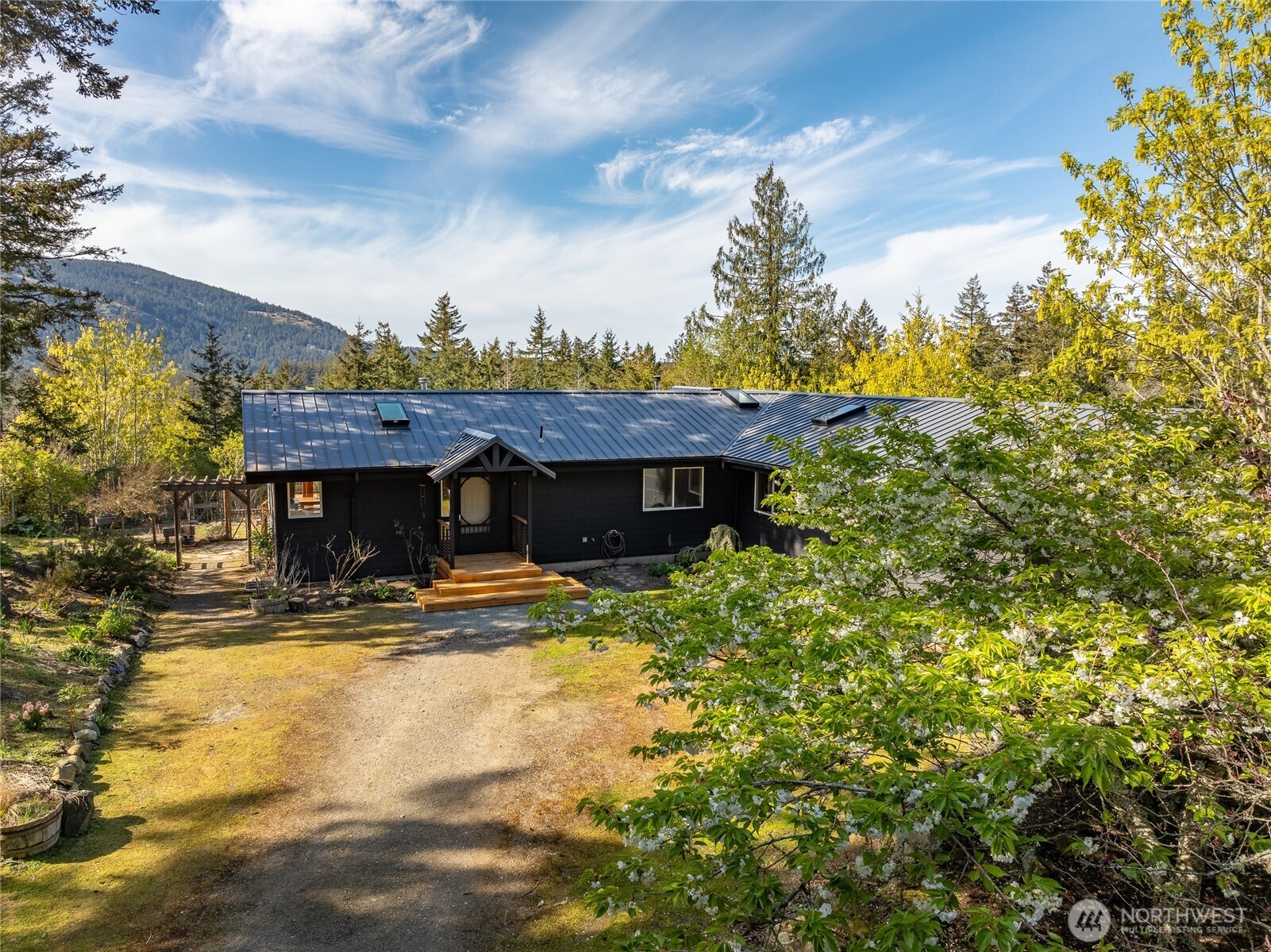 486 Wildwood Road Orcas Island, WA 98245 - Photo 29 of 37 a view of a house with wooden fence
