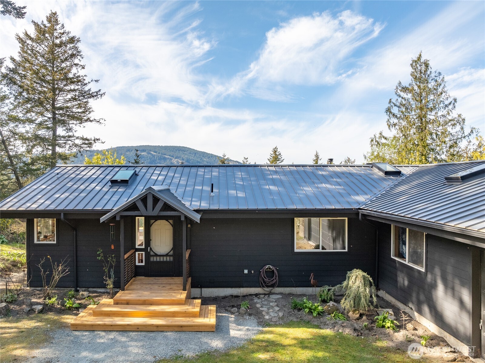 486 Wildwood Road Orcas Island, WA 98245 - Photo 33 of 37 a front view of a house with garden