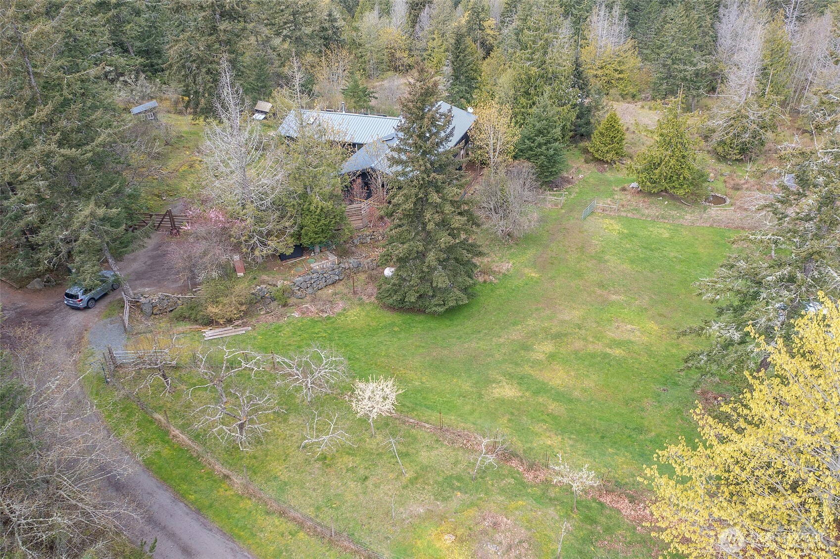 486 Wildwood Road Orcas Island, WA 98245 - Photo 35 of 37 a view of a garden from a bench