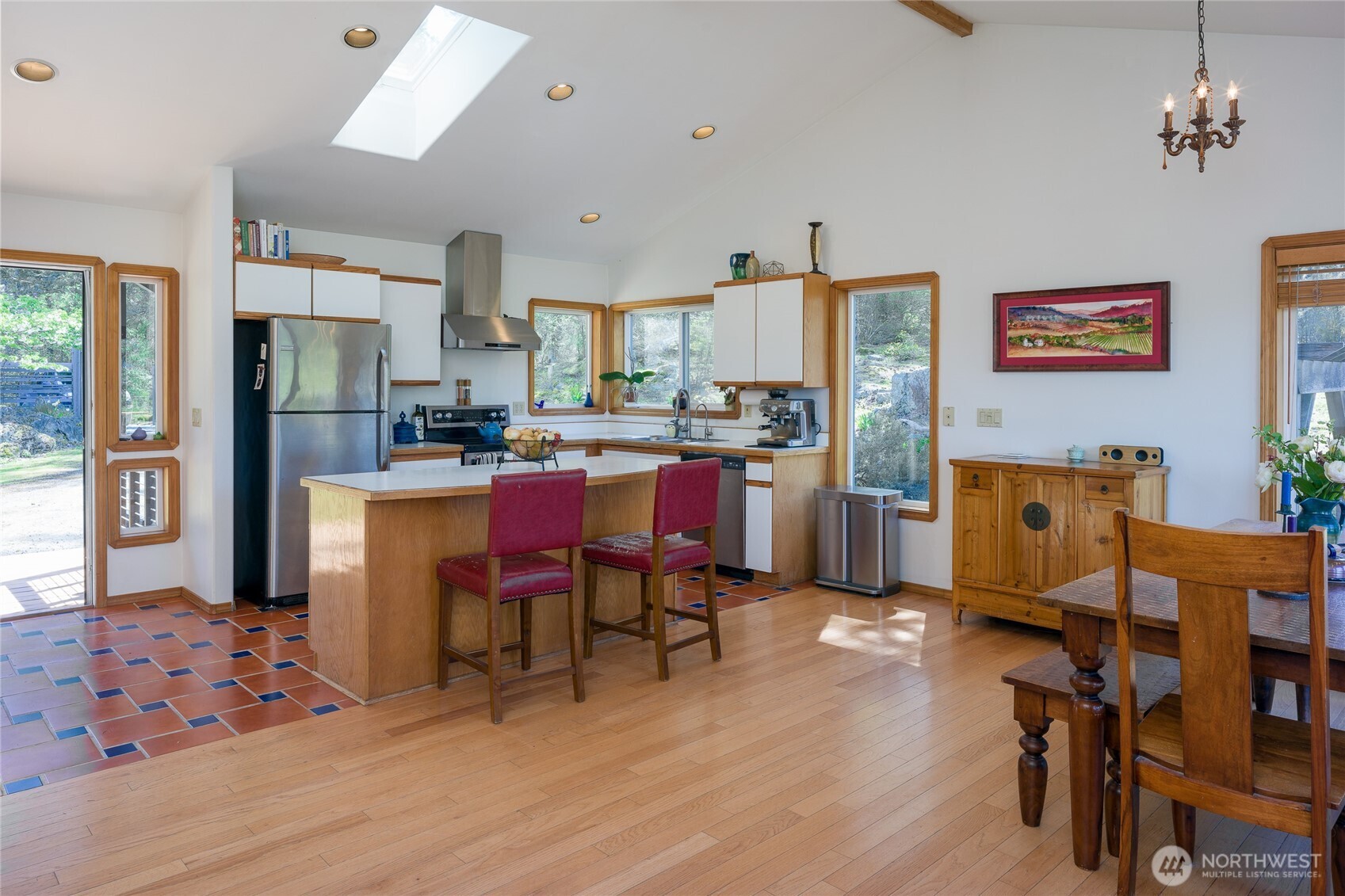 486 Wildwood Road Orcas Island, WA 98245 - Photo 5 of 37 a room with stainless steel appliances kitchen island granite countertop furniture and a dining table
