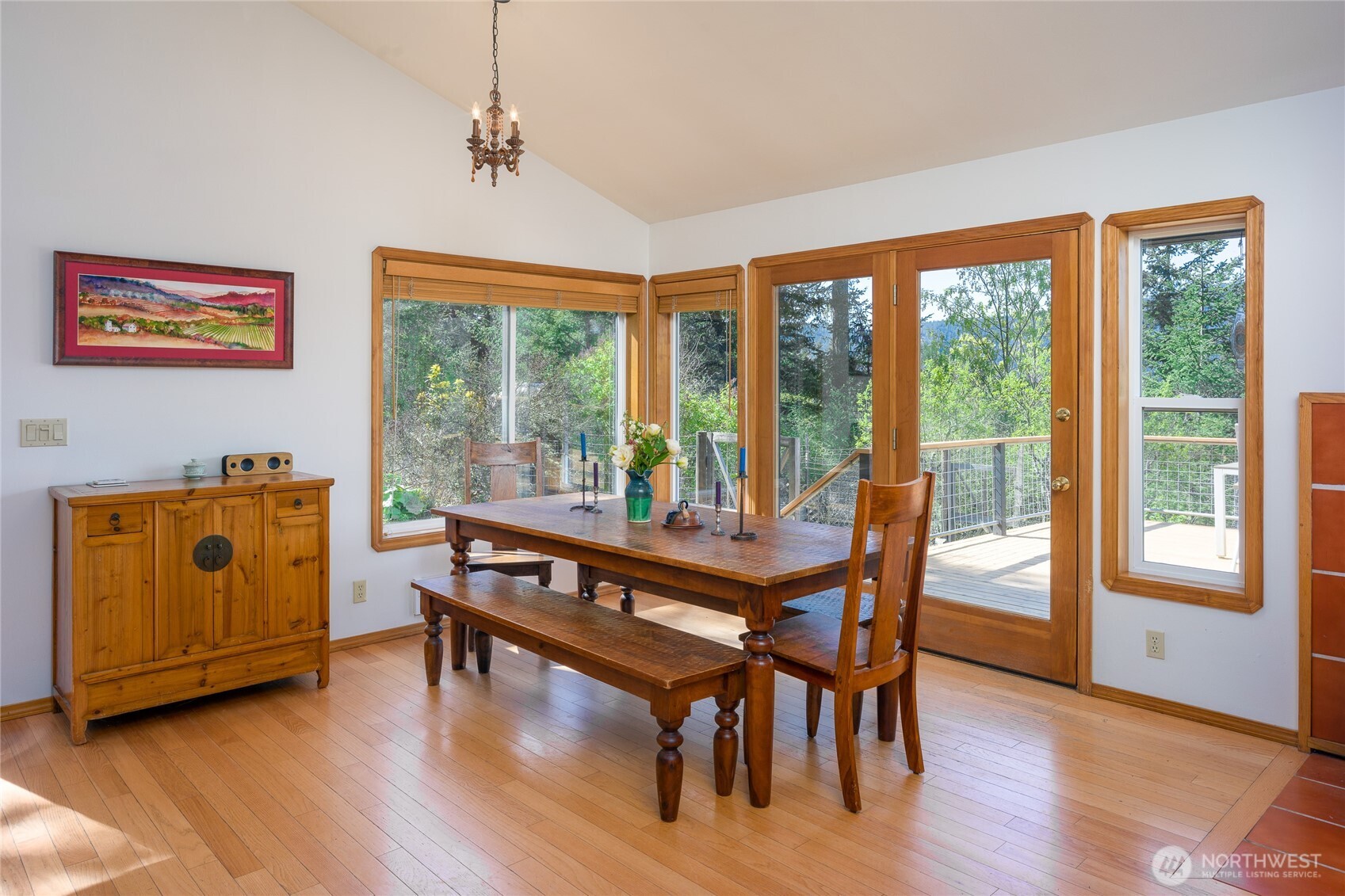 486 Wildwood Road Orcas Island, WA 98245 - Photo 10 of 37 a view of a dining room with furniture window and wooden floor