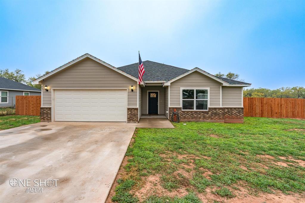 331 Hog Eye Road Abilene, TX 79602 - Photo 1 of 1 a view of a yard in front of a house with plants
