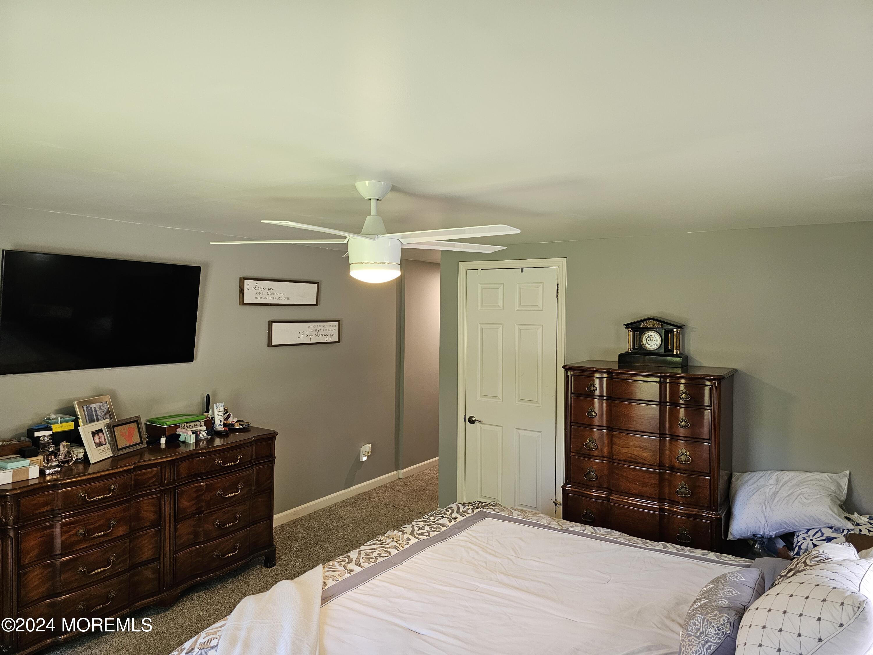 42 Middlesex Road Matawan, NJ 07747 - Photo 11 of 33 a bedroom with a bed and a flat screen tv