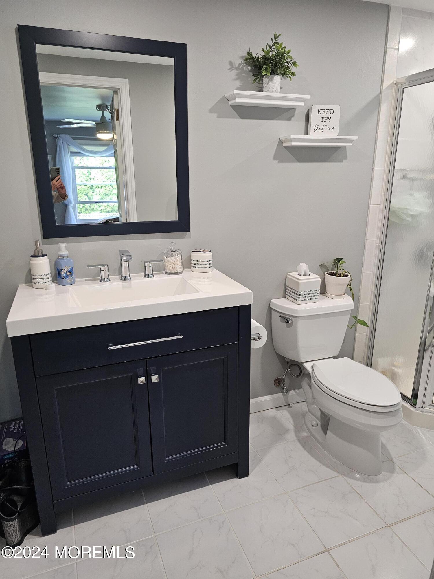 42 Middlesex Road Matawan, NJ 07747 - Photo 13 of 33 a bathroom with a toilet sink and mirror