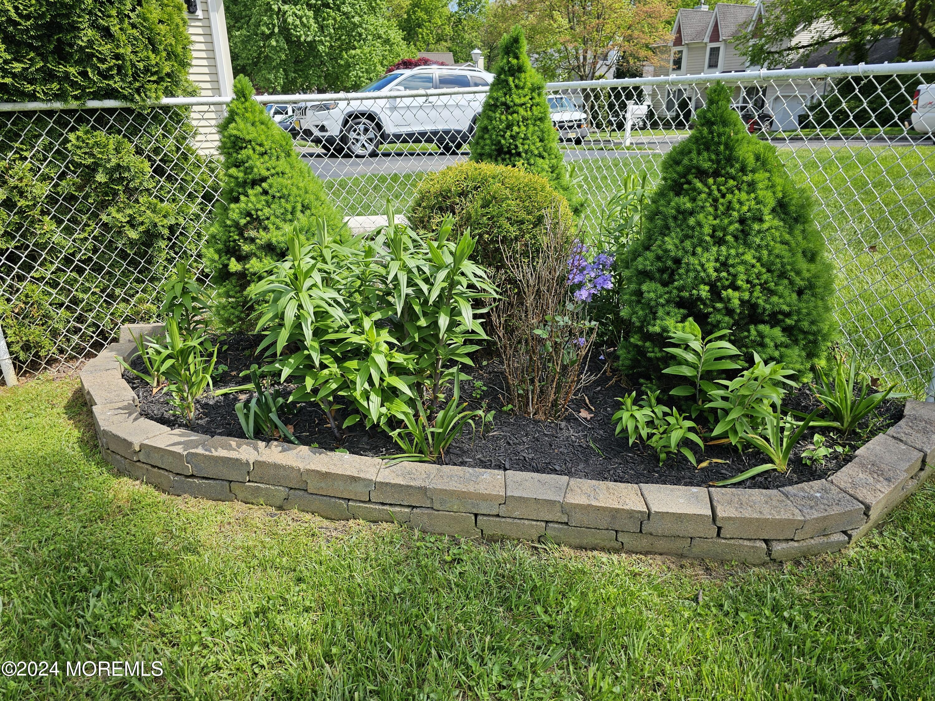 42 Middlesex Road Matawan, NJ 07747 - Photo 25 of 33 a view of a garden with a fountain