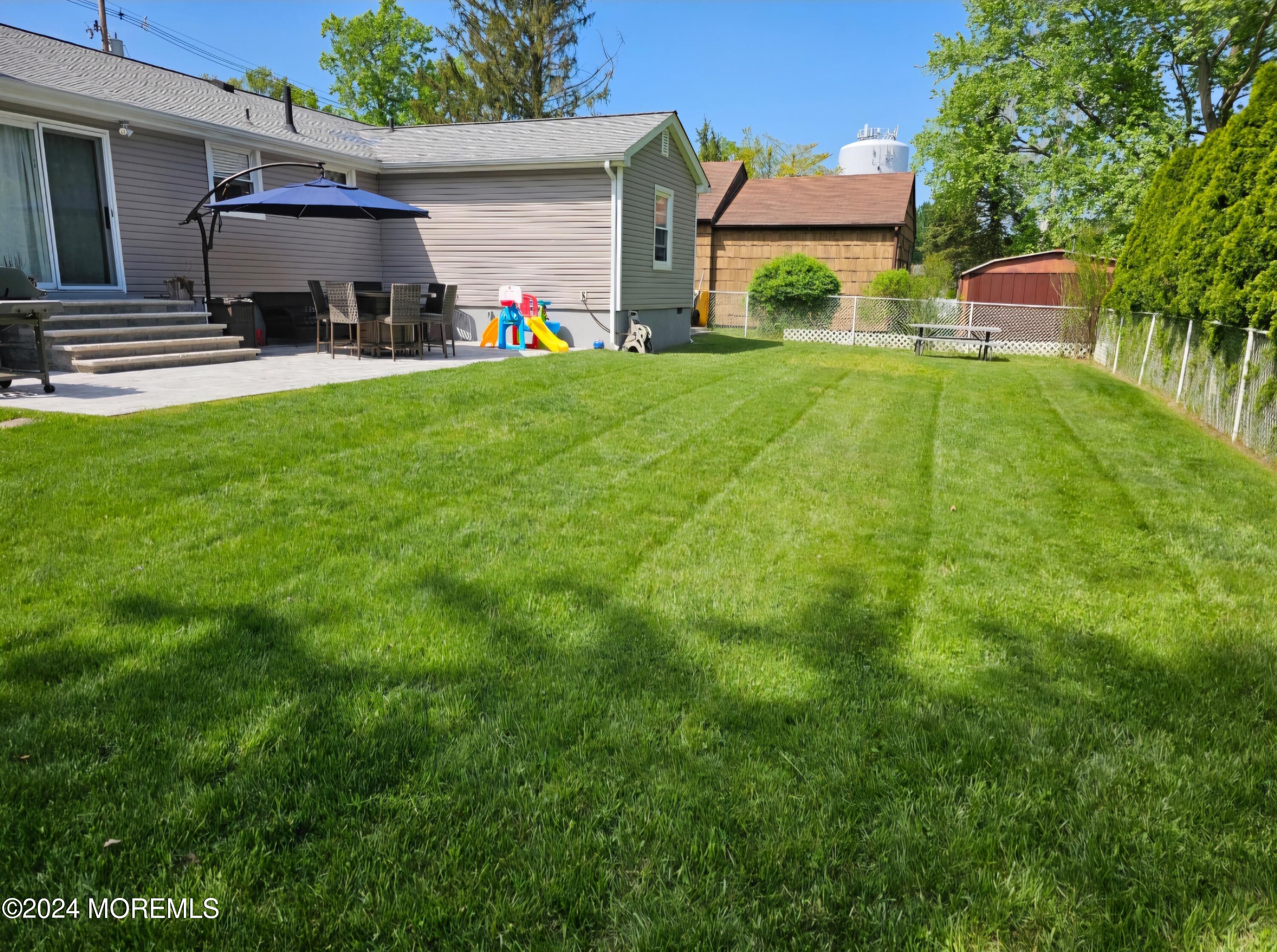 42 Middlesex Road Matawan, NJ 07747 - Photo 27 of 33 a view of a house with a back yard