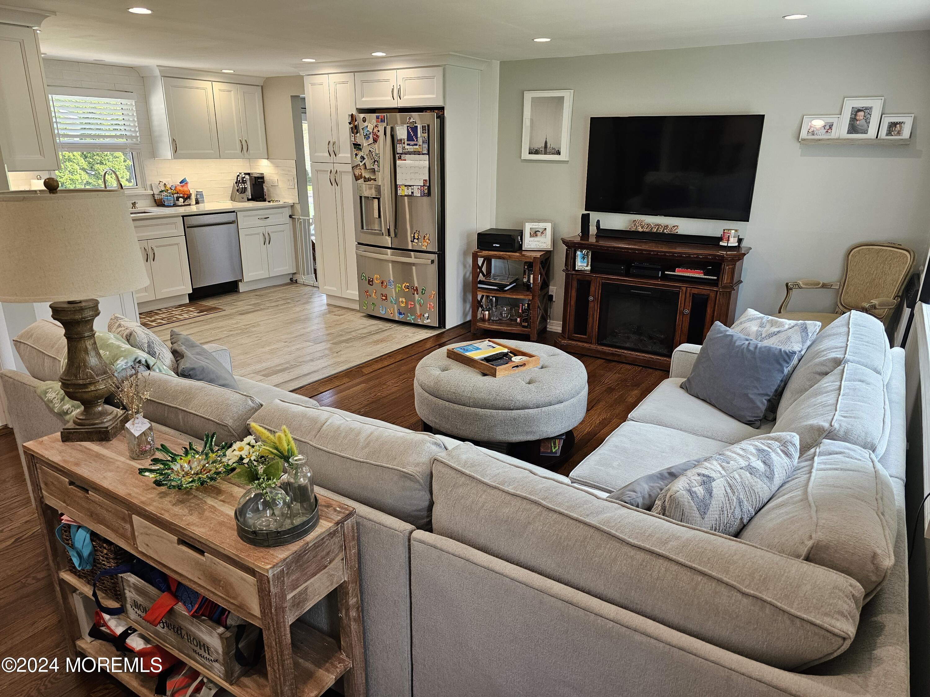 42 Middlesex Road Matawan, NJ 07747 - Photo 4 of 33 a living room with furniture and a flat screen tv