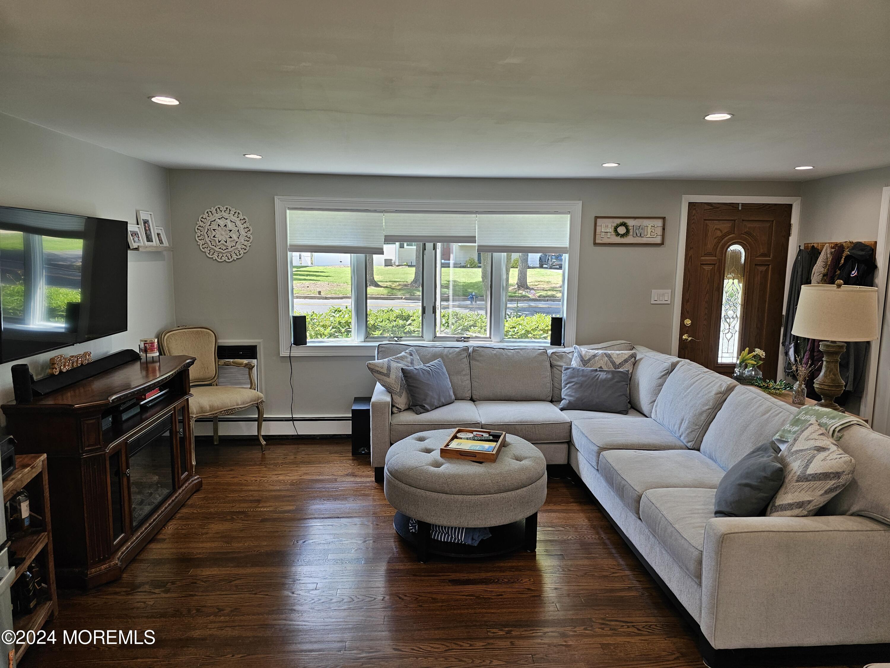 42 Middlesex Road Matawan, NJ 07747 - Photo 5 of 33 a living room with furniture and a flat screen tv