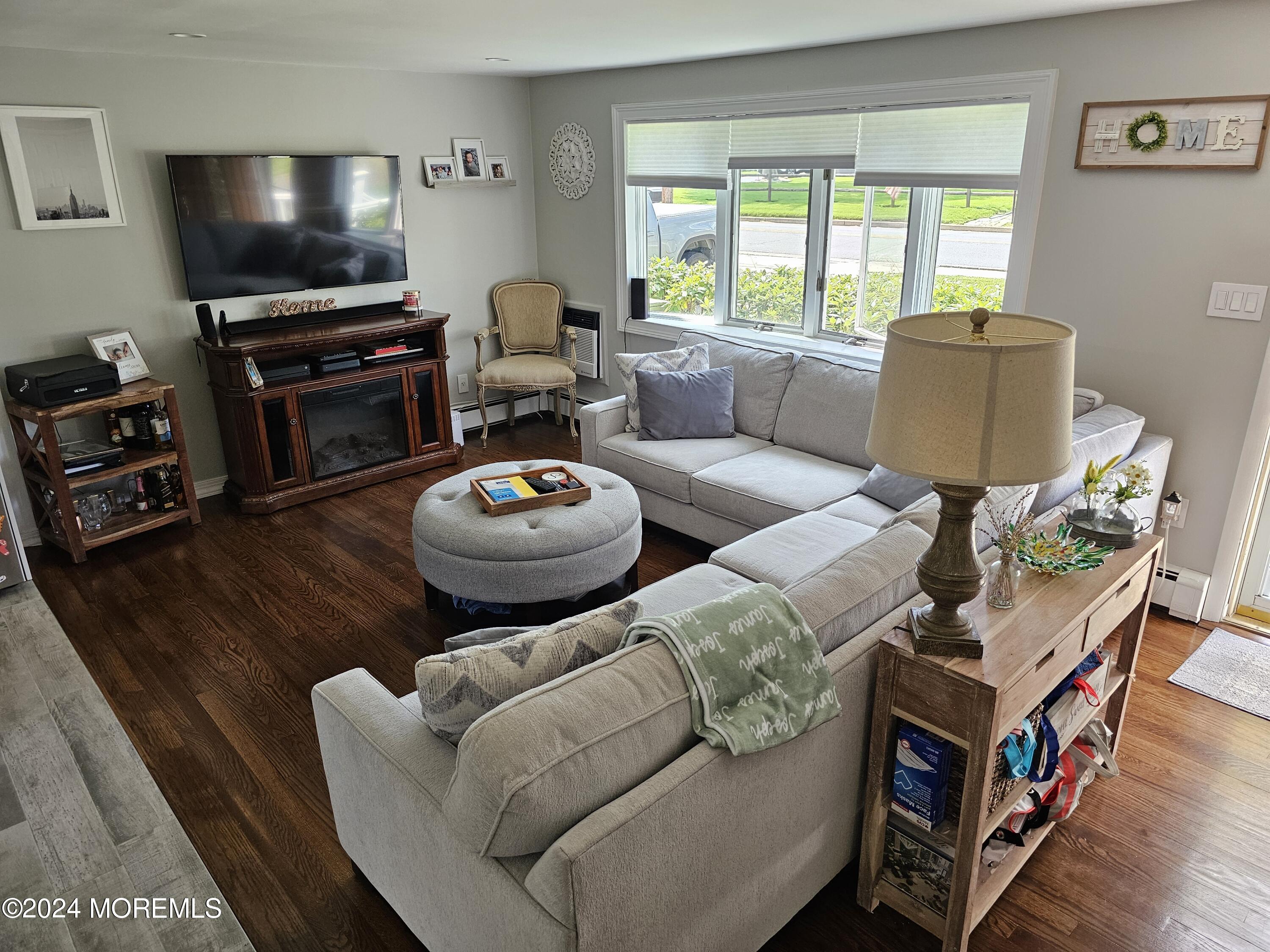 42 Middlesex Road Matawan, NJ 07747 - Photo 6 of 33 a living room with furniture and a flat screen tv