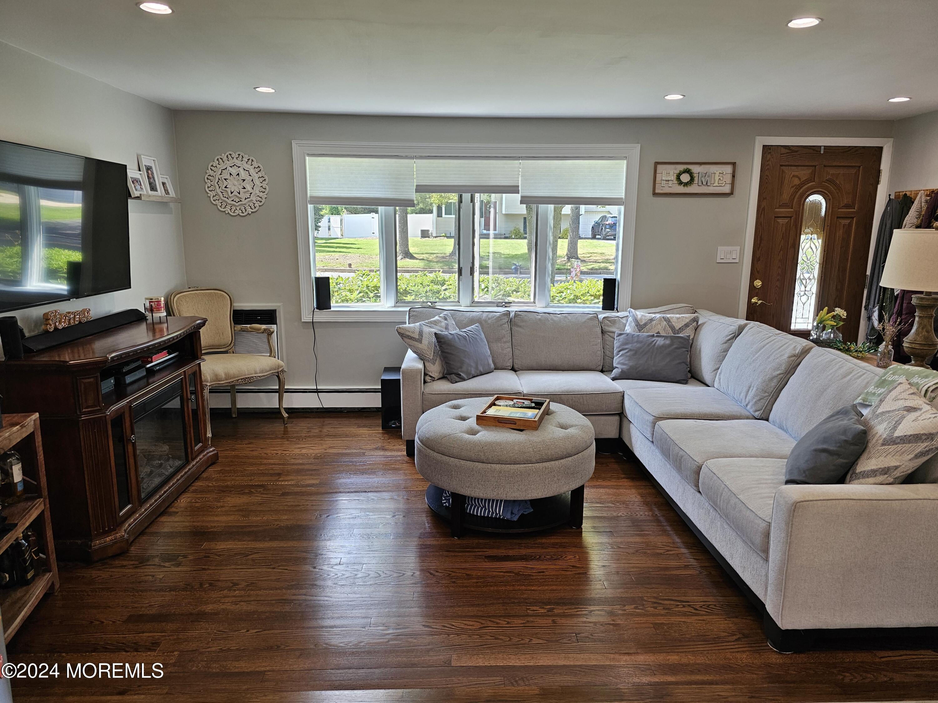 42 Middlesex Road Matawan, NJ 07747 - Photo 7 of 33 a living room with furniture and a flat screen tv