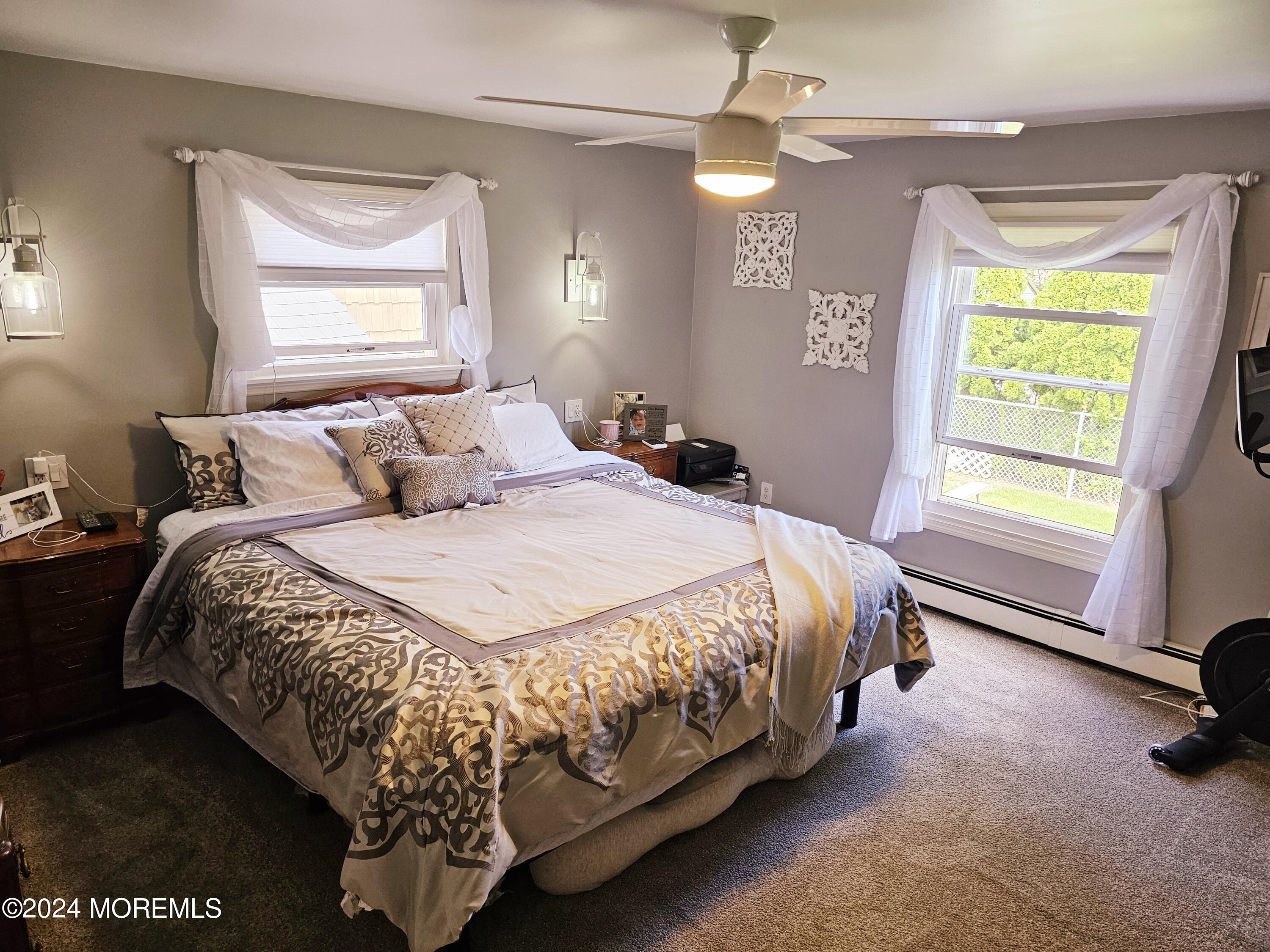 42 Middlesex Road Matawan, NJ 07747 - Photo 10 of 33 a bed sitting in a bedroom next to a window