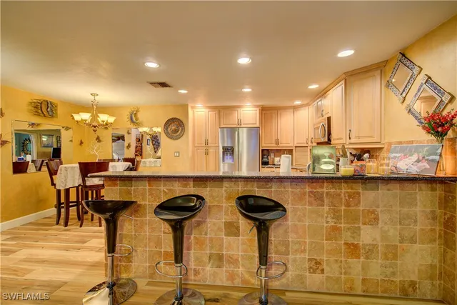 a bathroom with sinks granite countertop double vanity and a mirror