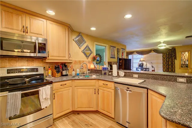 a view of a dining room kitchen with a table and chairs