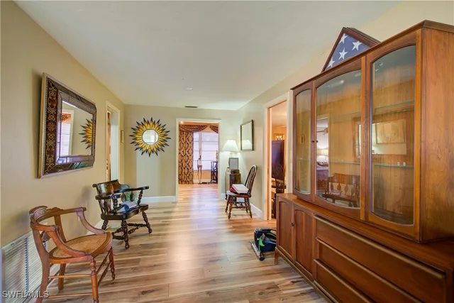 a bedroom with a bed and a large mirror with a flat tv screen
