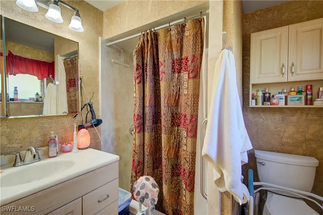 a bedroom with furniture and wooden floor