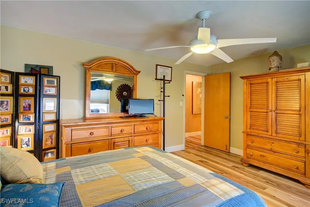 a view of a patio with a table chairs and garden