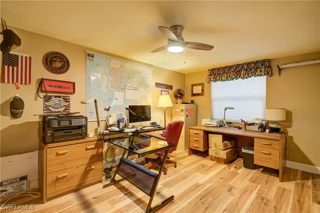 a view of a chair and tables in the balcony
