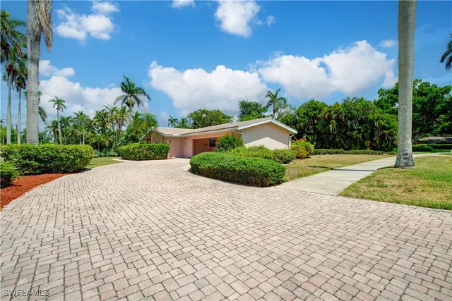 a view of a backyard of the house