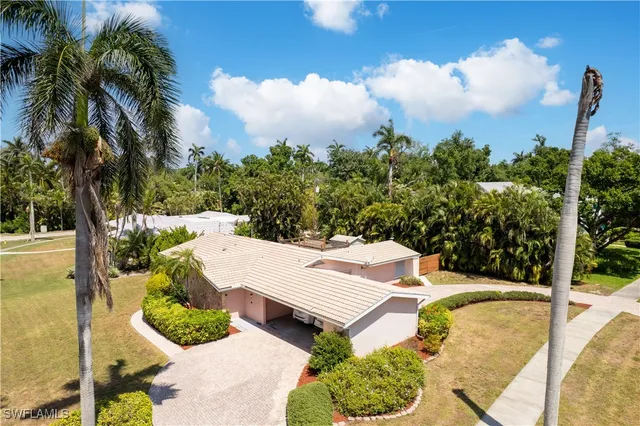 a view of a patio with iron fence