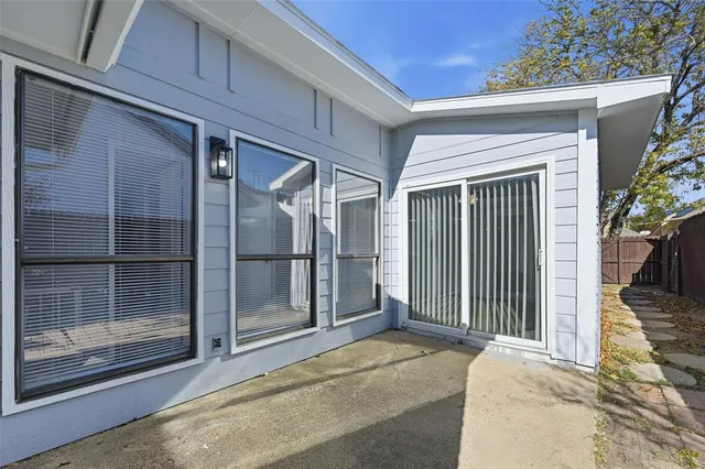 a view of a house with a glass door and glass door