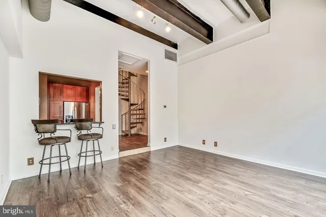 a kitchen with granite countertop a stove sink and microwave