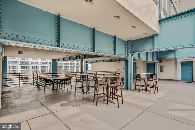 a view of a dinning table and chairs in patio