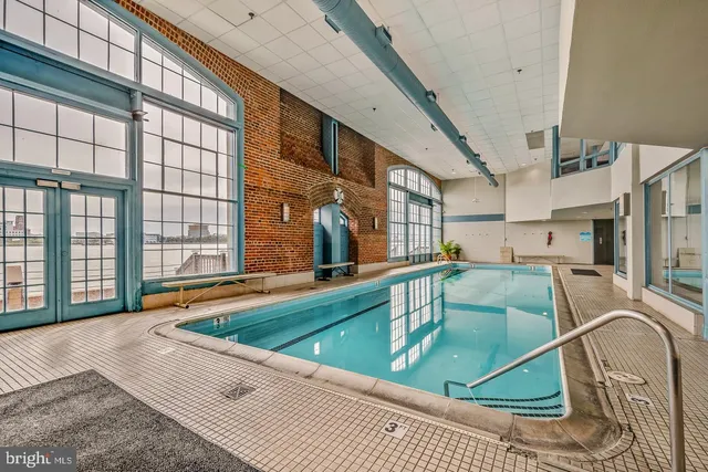 a view of a swimming pool with a patio