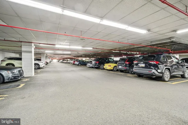 a view of staircase with a front door