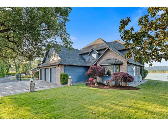 a front view of the house with a garden