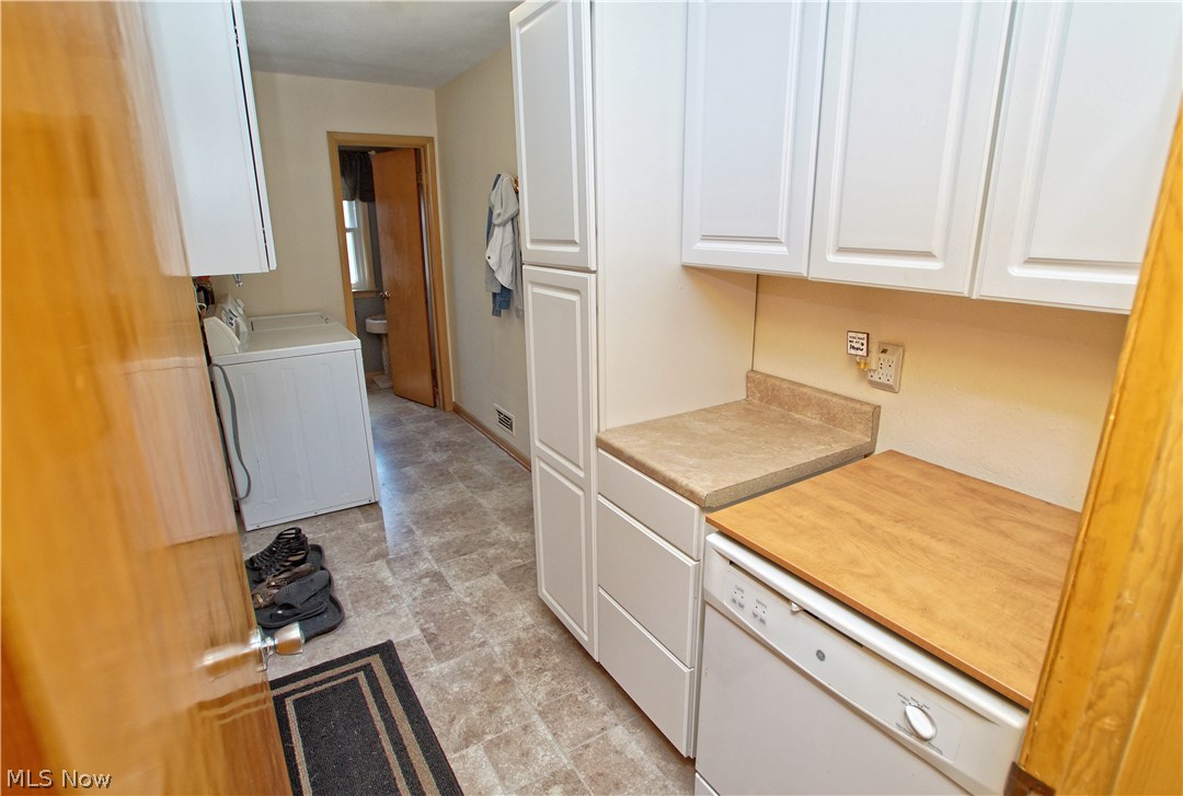 8601 Royal Ridge Drive Parma, OH 44129 - Photo 23 of 33 Off the kitchen is the mud room with extra cabinet space and dishwasher storage.