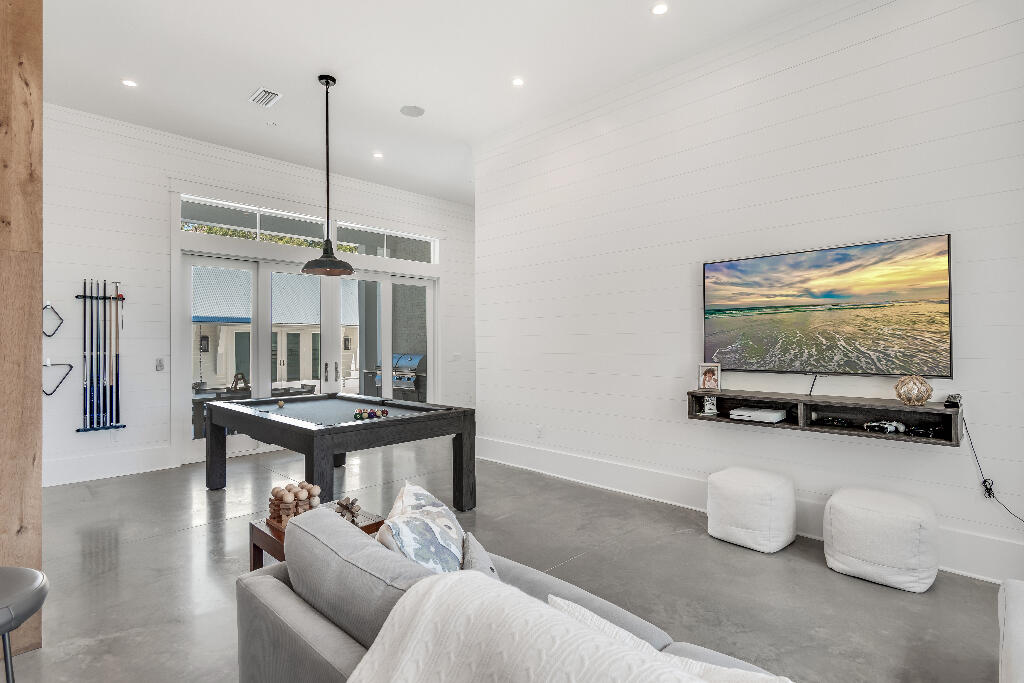 90 Sandstone Street Santa Rosa Beach, FL 32459 - Photo 12 of 73 a living room with furniture and a chandelier