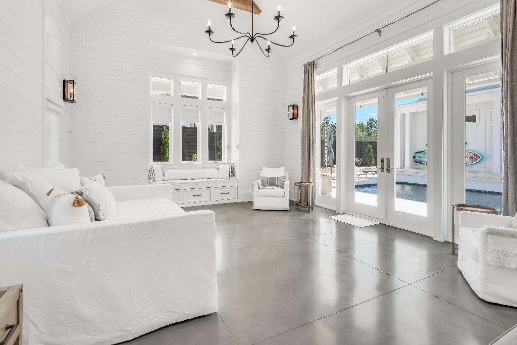 90 Sandstone Street Santa Rosa Beach, FL 32459 - Photo 18 of 73 a living room with furniture and large windows