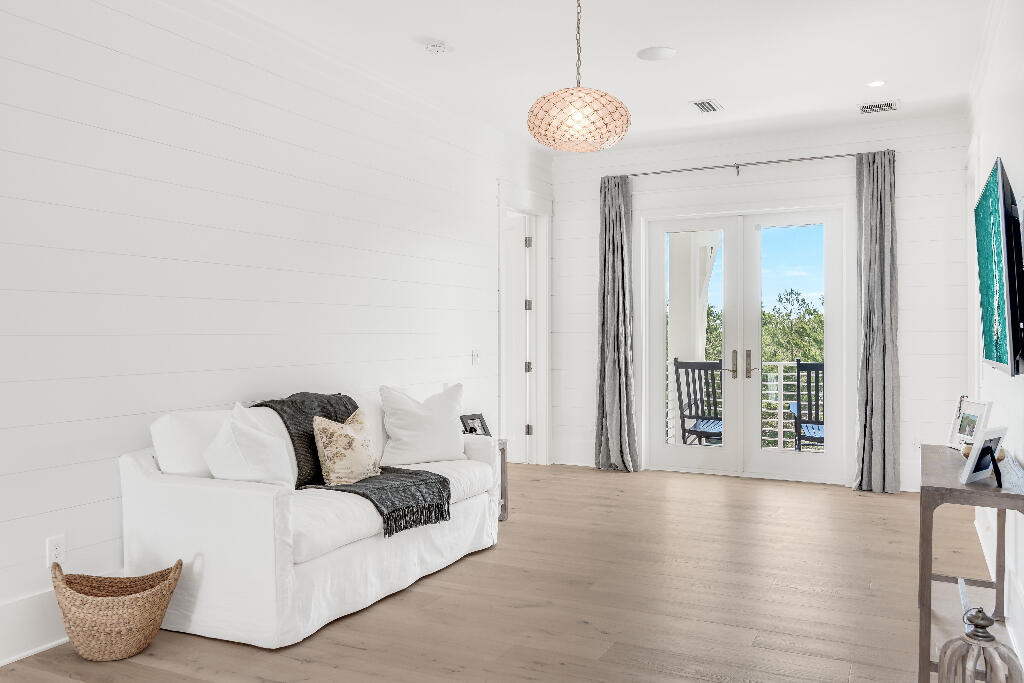 90 Sandstone Street Santa Rosa Beach, FL 32459 - Photo 26 of 73 a living room with furniture and wooden floor