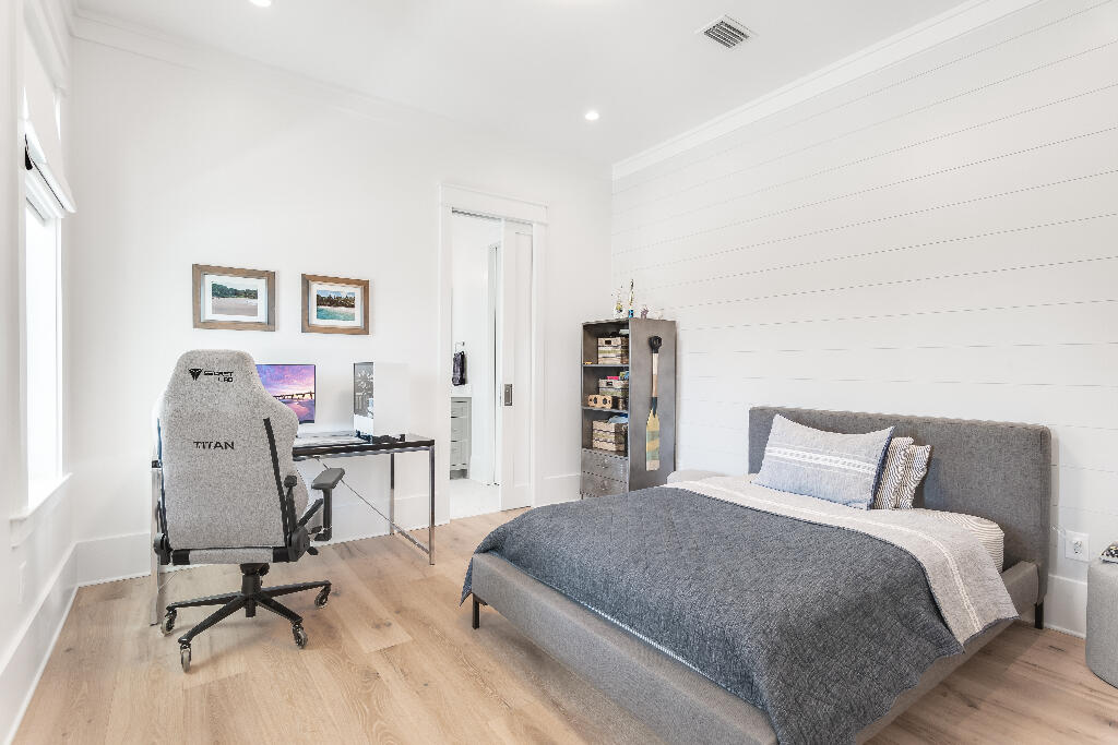 90 Sandstone Street Santa Rosa Beach, FL 32459 - Photo 33 of 73 a bedroom with a bed a desk and chair next to a window