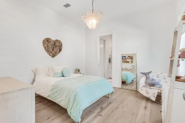 a kitchen with stainless steel appliances a white stove top oven and a wooden floors