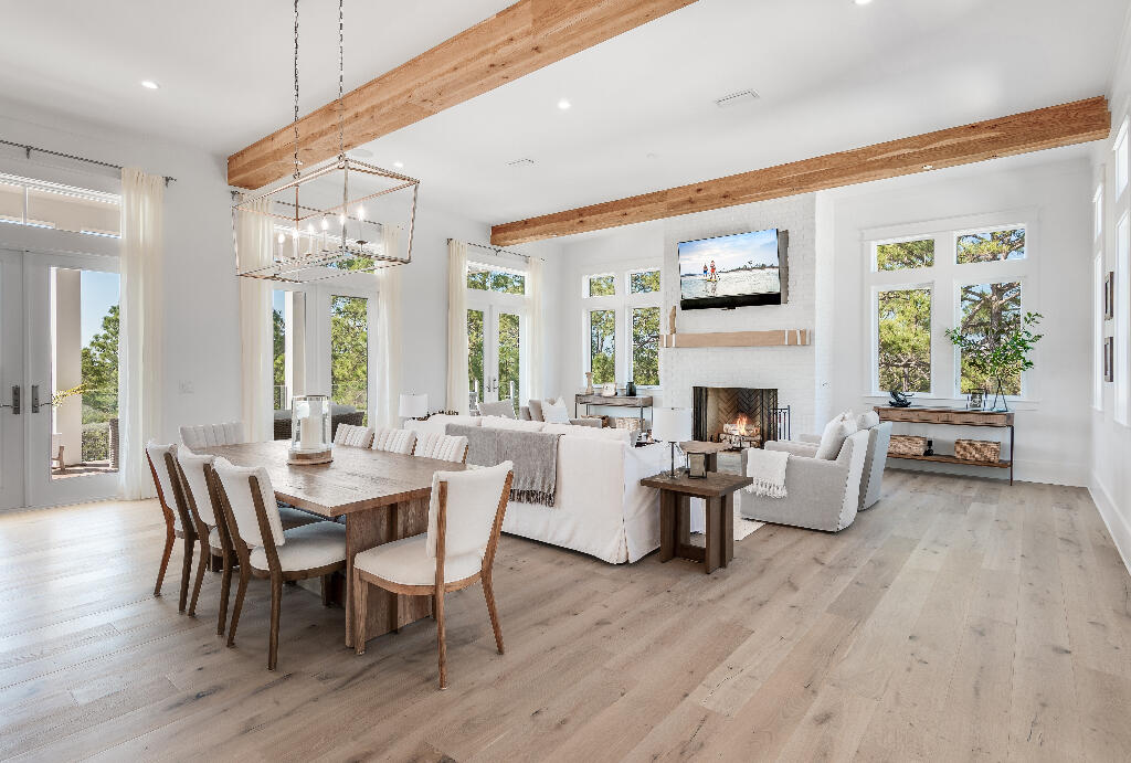 90 Sandstone Street Santa Rosa Beach, FL 32459 - Photo 40 of 73 a view of a dining room with furniture window and wooden floor
